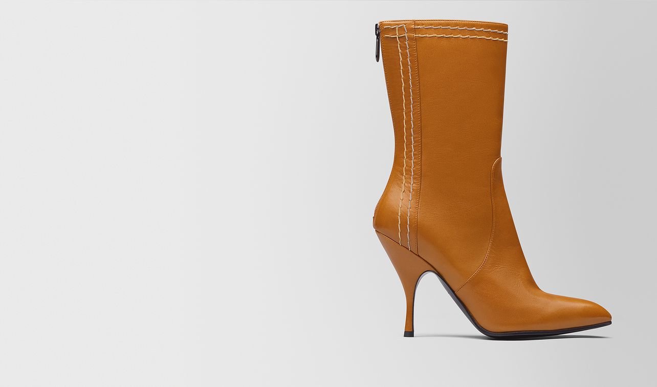 orange kid moodec chain boot landing