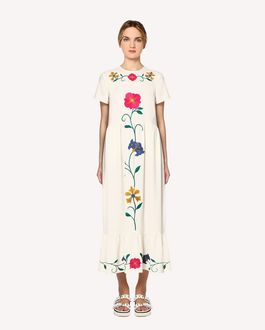 white dress with embroidered flowers