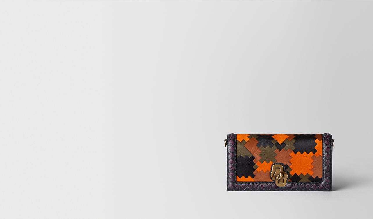 multicolor pony/karung bv patch knot clutch landing