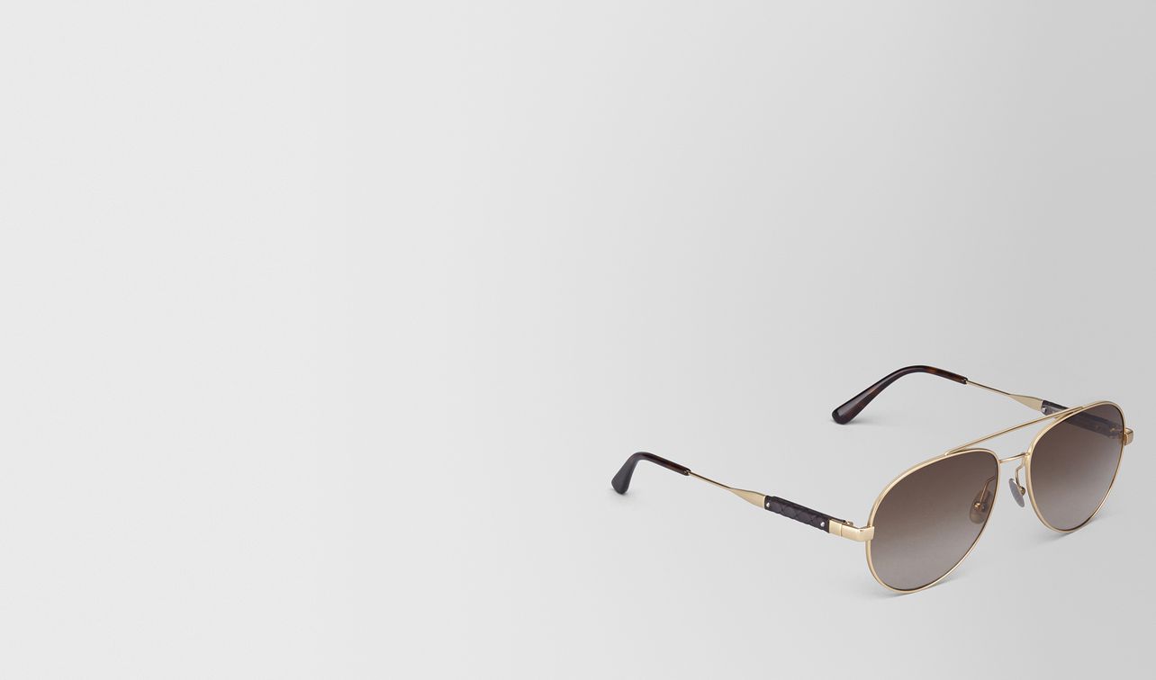 sonnenbrille aus metall in gold mit braunen gläsern landing