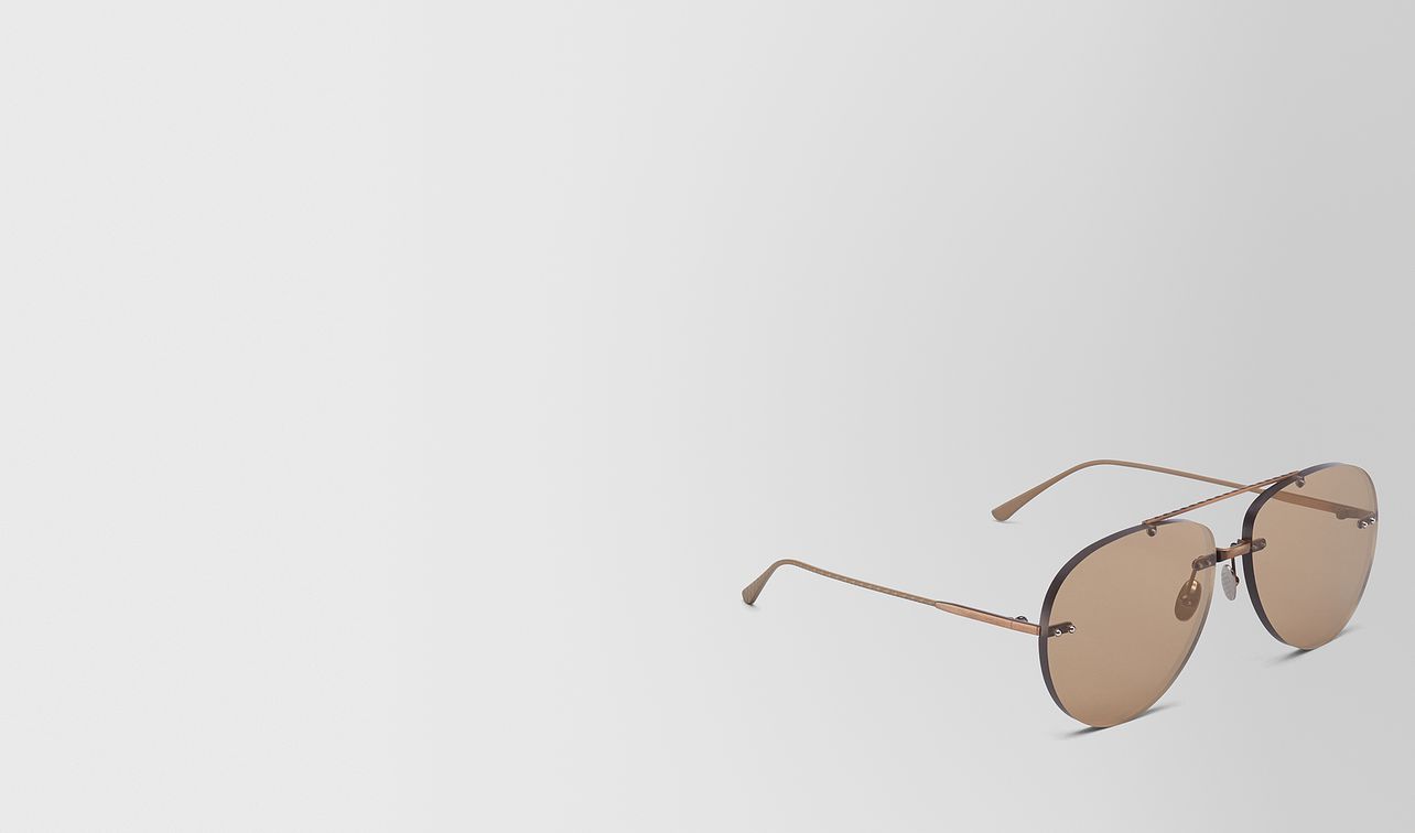 brown metal sunglasses landing