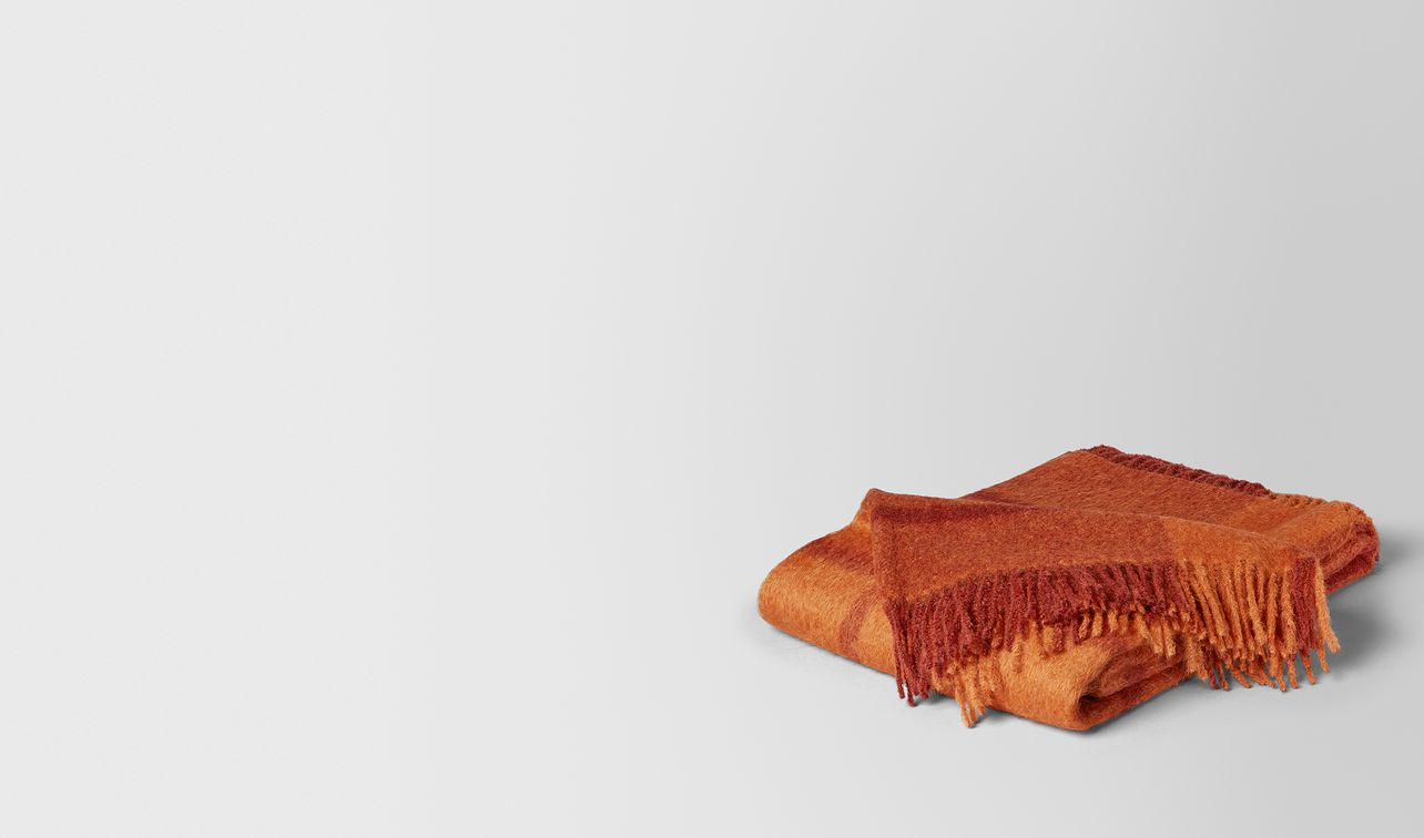 tangerine orange alpaca and wool kaunis blanket landing