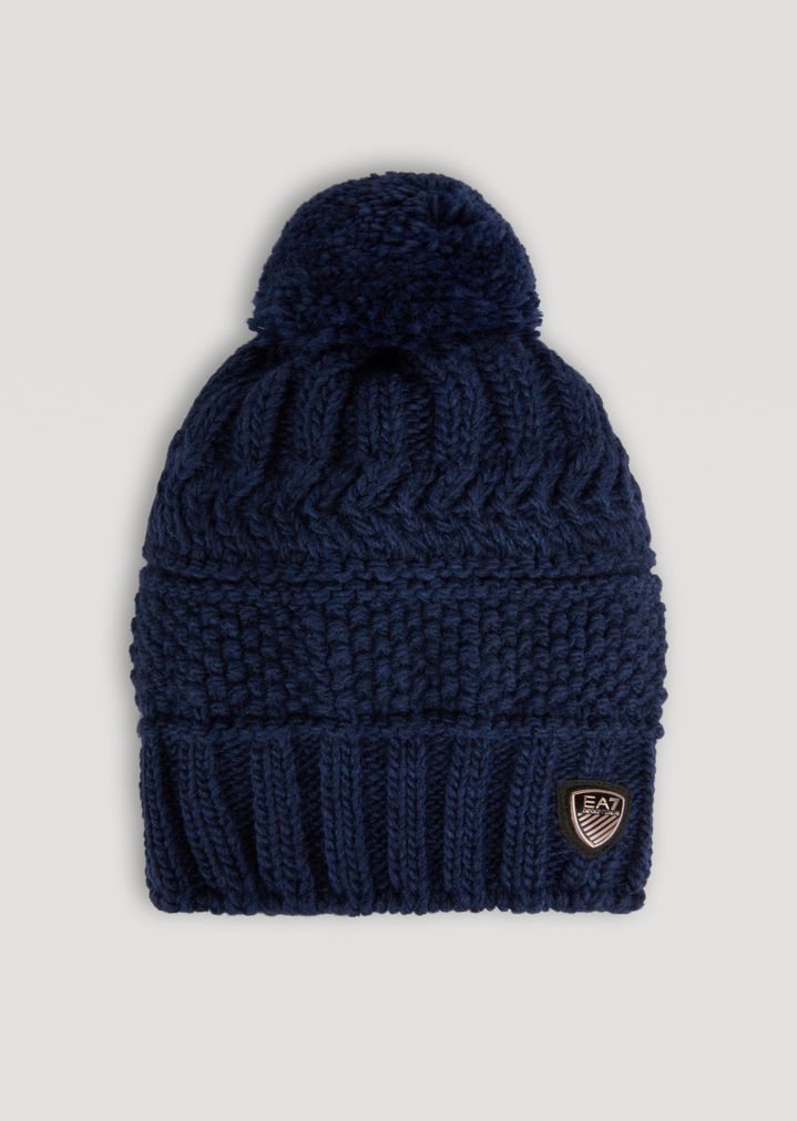 Gorro de punto labrado con pompón Gorro de punto labrado con pompón