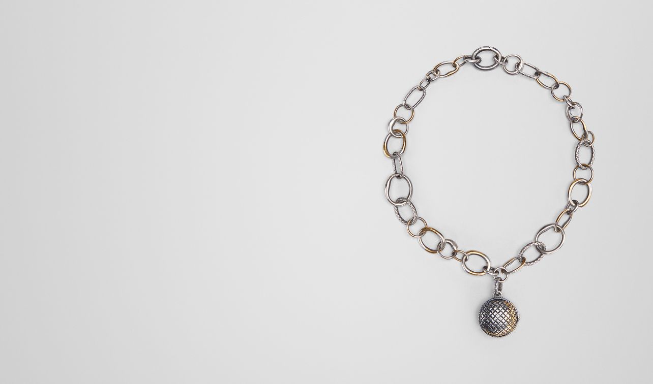 antique silver/yellow gold patina dichotomy pendant landing
