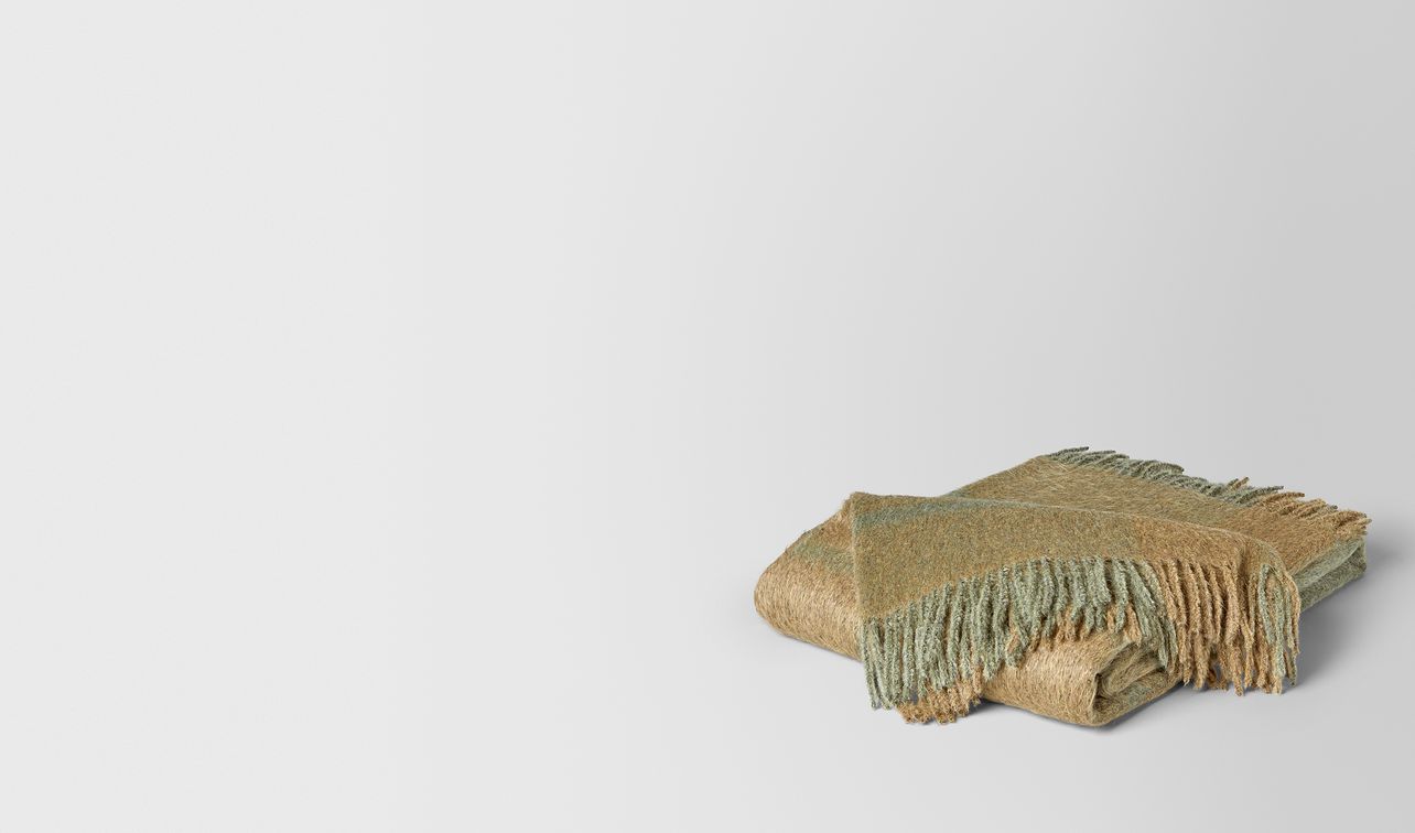 olive light green alpaca and wool kaunis blanket landing