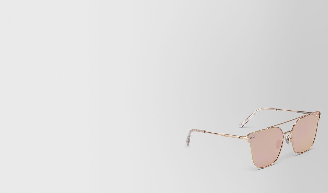 gold metal sunglasses landing