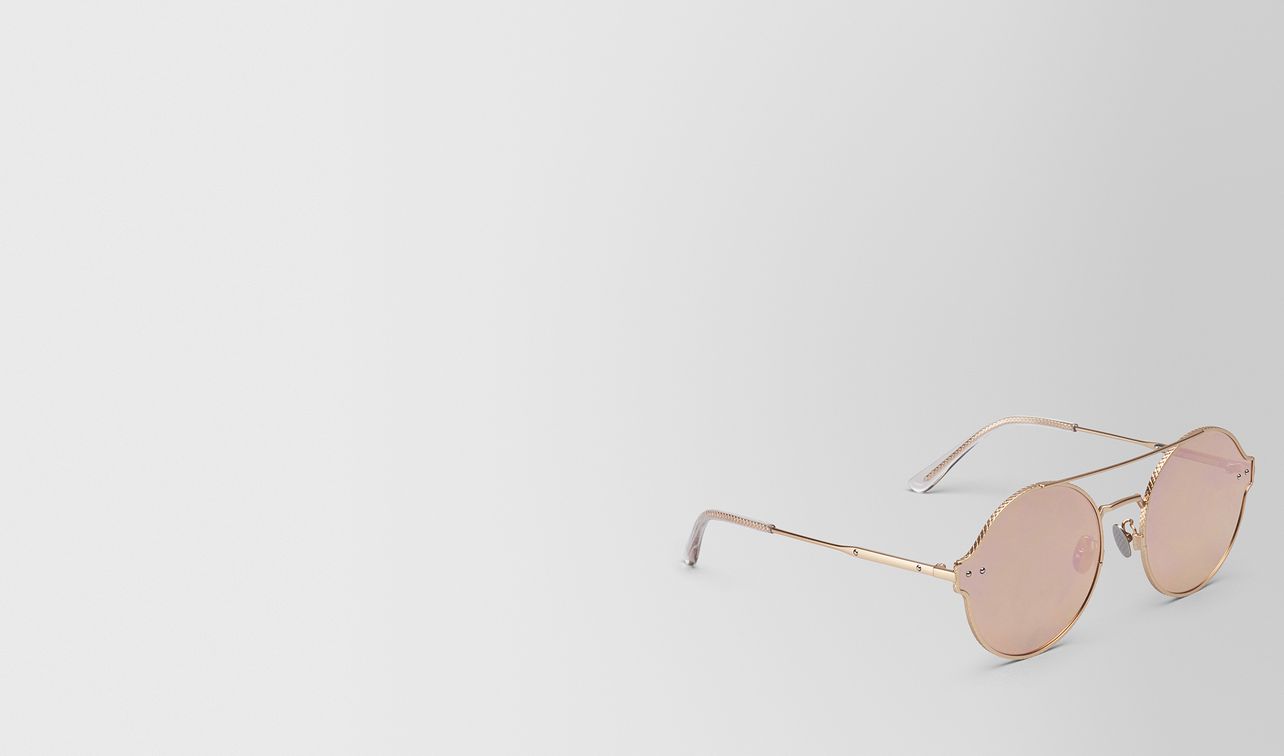 gold metal sunglasses landing