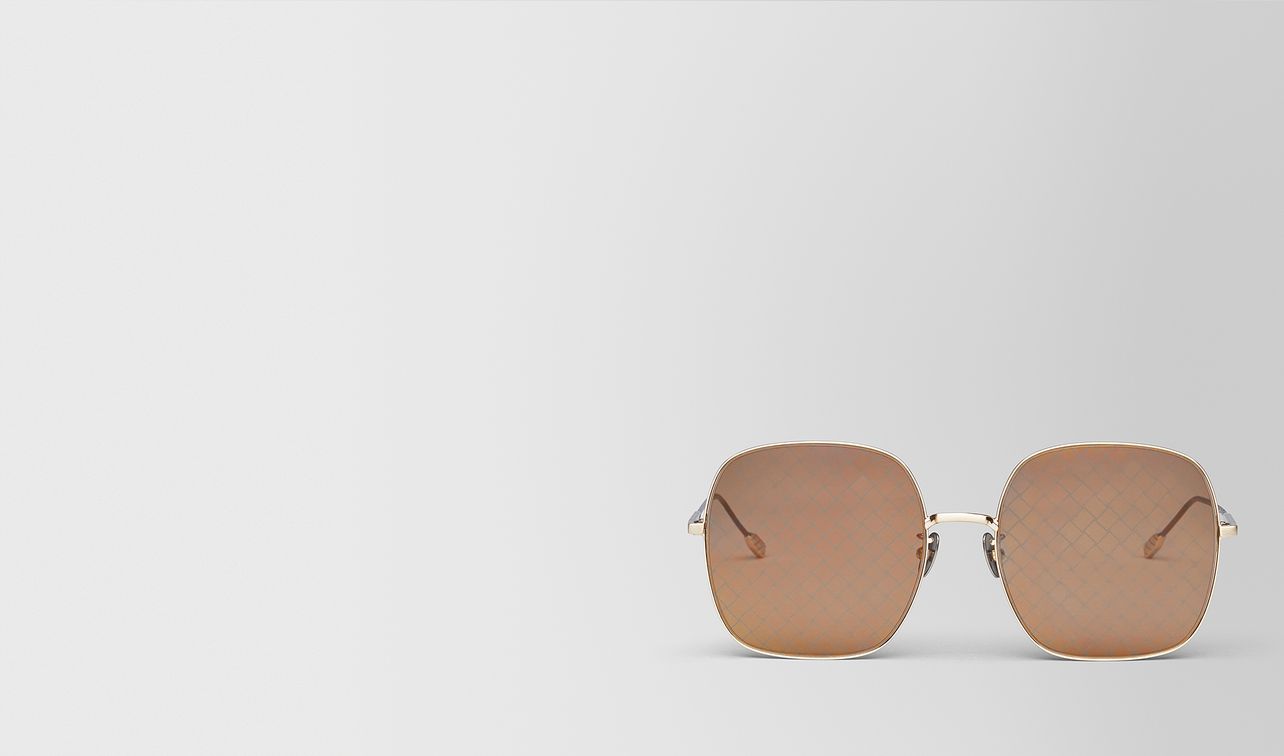 gold metal sunglasses landing
