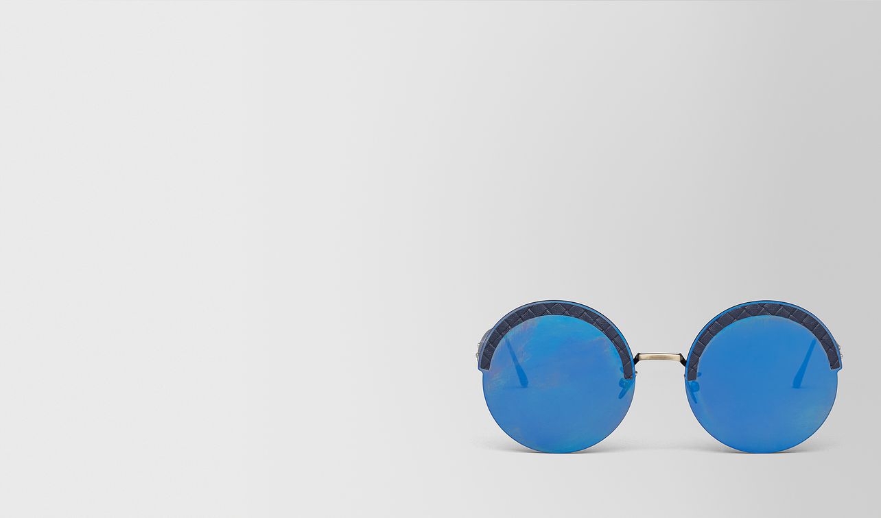 gold metal/leather sunglasses landing
