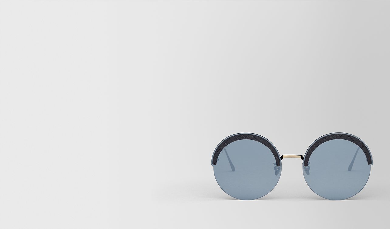 gold metal/leather sunglasses landing